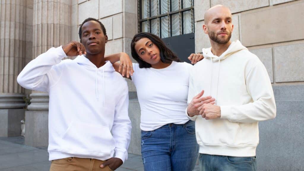 A courier delivering a package labeled “Miami Sweatsuit Supplier” next to a luxury vehicle in a sunny urban setting.