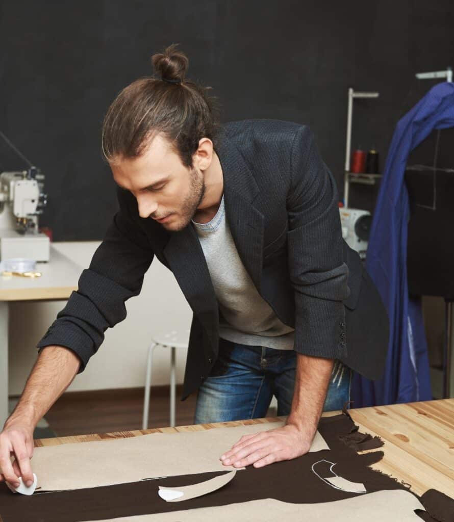 “Sample custom sweatsuit designs with branded embroidery on hoodies and jogger sets, made in America.”