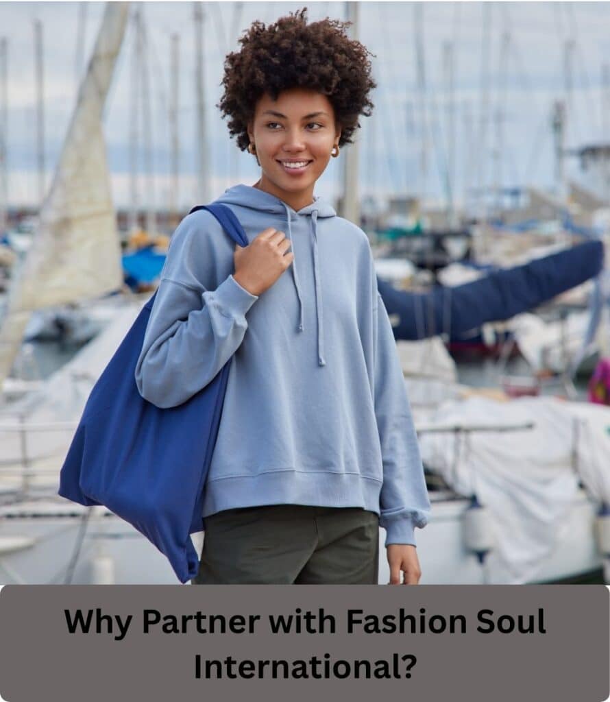 Rich version: "Interior of a Phoenix sweatsuit manufacturing facility showing workers and automated cutting tables for private label production."