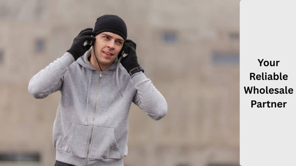 A confident business team shaking hands across a warehouse, symbolizing a reliable wholesale partner.