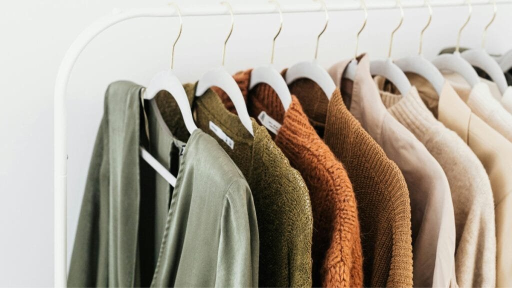 A collection of rolled softest cloth material bolts in various colors showcasing different fabric textures