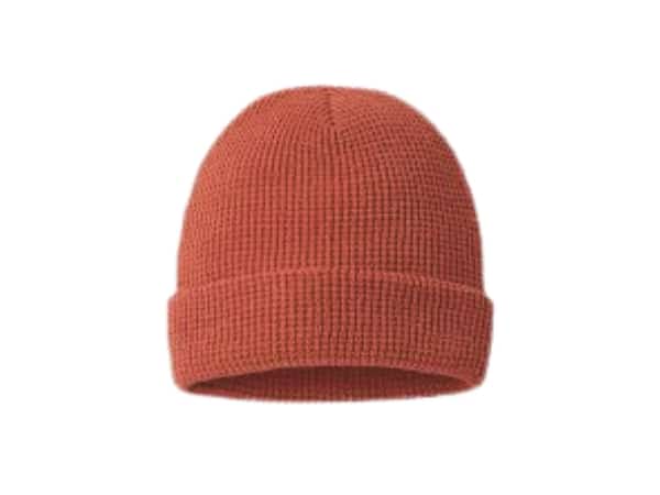 Rust-colored knit cuffed beanie hat on a white background