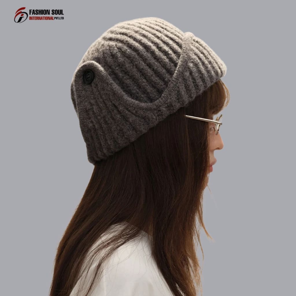 "Factory floor with workers sewing and inspecting custom beanies in Maryland"