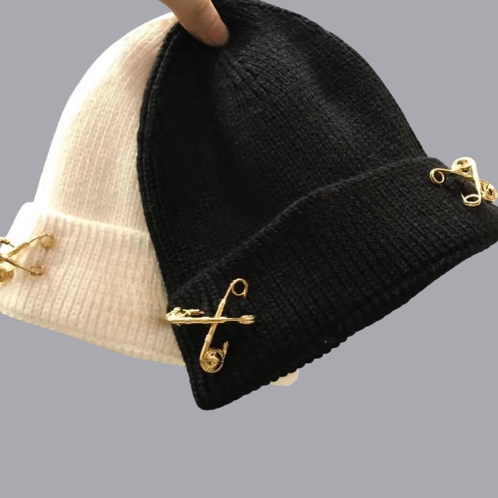 A rack of assorted colorful beanies ready for customization at a North Carolina manufacturing site.