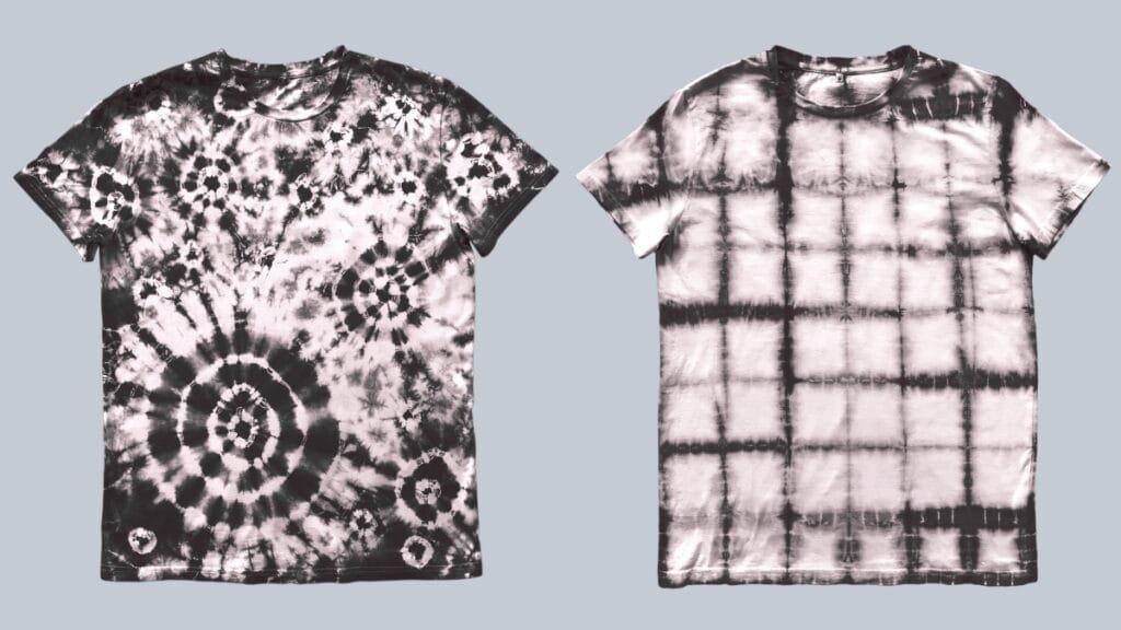 A close-up of black tie dye color combos on a t-shirt showing a spiral pattern