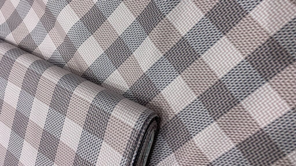 Close-up of a sustainable fabric with a plant-based dye, symbolizing paid fabric emerging from the rise of sustainable fashion.