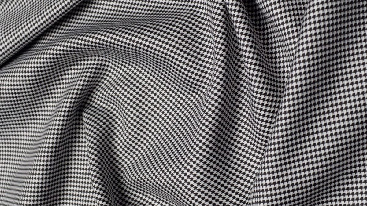 "Concept illustration of a Virtual Chassis Fabric weaving digital and textile technology to create seamless, scalable textile networks."