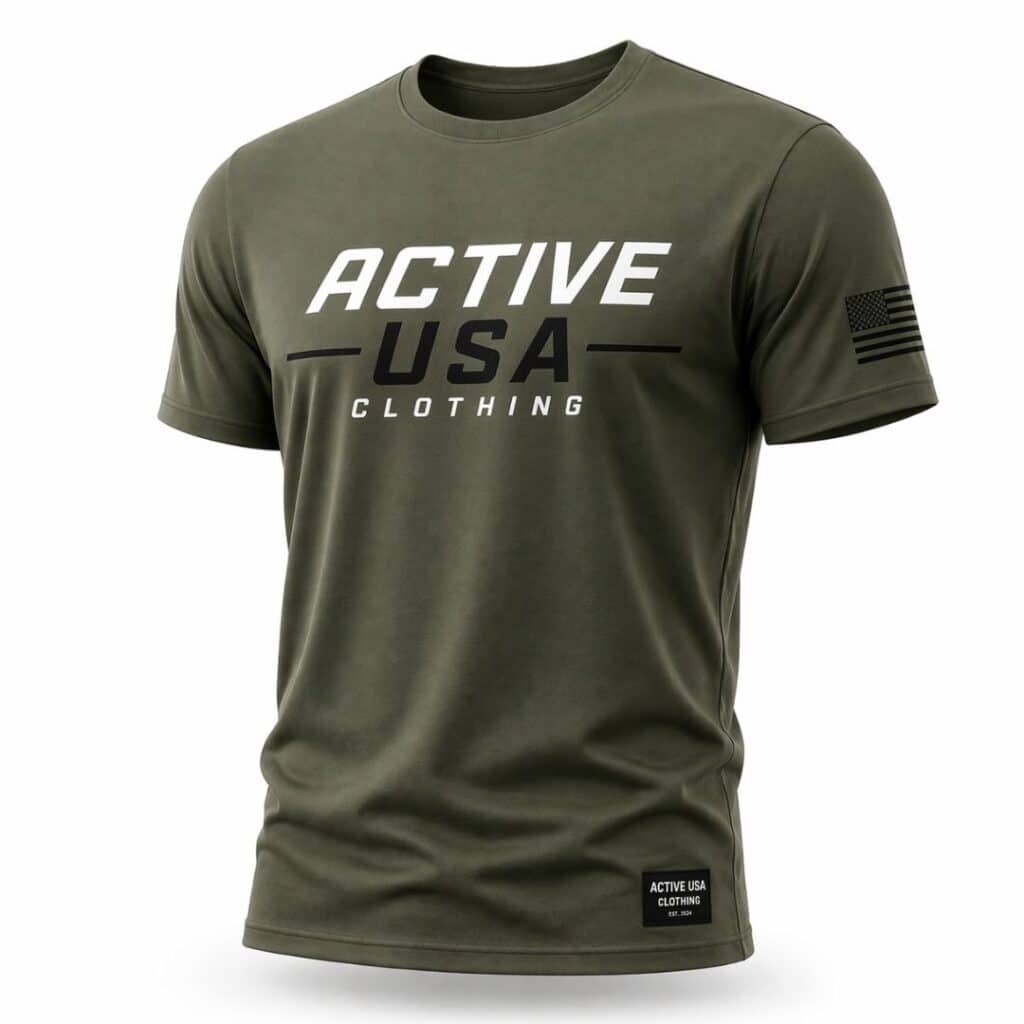 Olive green t-shirt with white "ACTIVE -USA- CLOTHING" text on chest, black and white American flag on upper left sleeve, and "ACTIVE USA CLOTHING EST. 2024" tag near bottom hem.