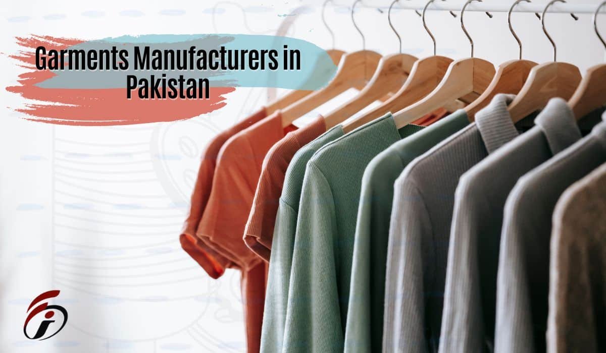 "A row of neatly arranged garments on wooden hangers, showcasing various shades of green and orange, with text overlay stating 'Garments Manufacturers in Pakistan'.