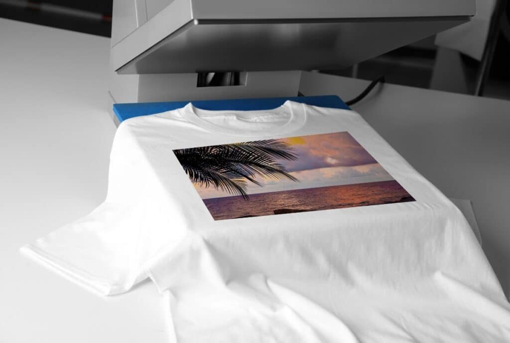 A modern American factory floor producing custom workwear T-shirts, with branding options and printed logos.