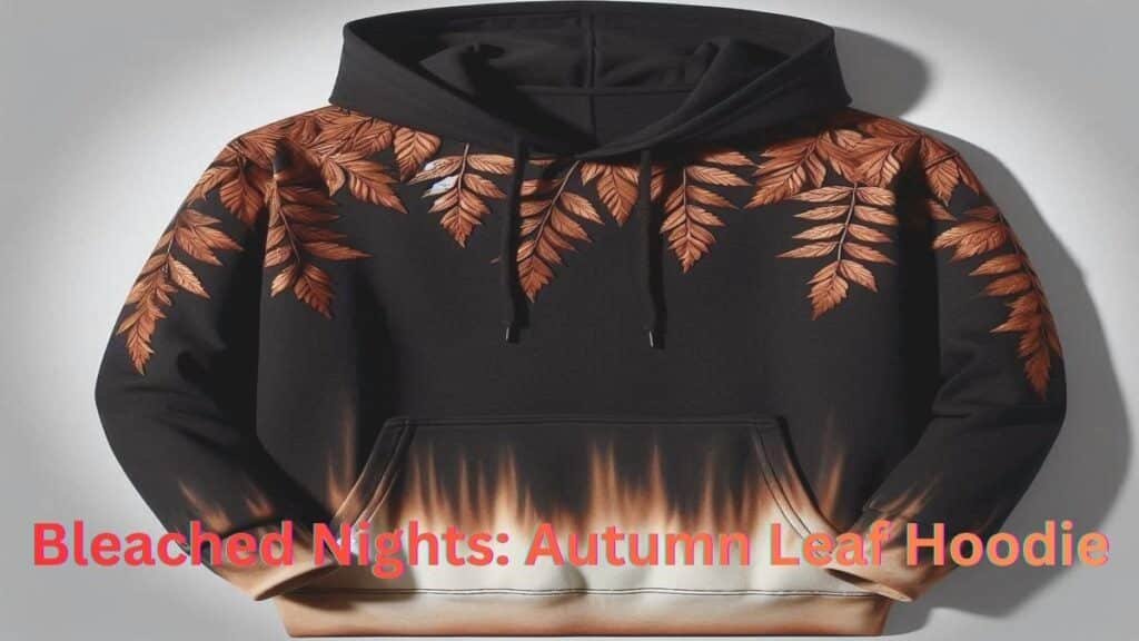 Black hoodie with a gradient bleach-like fade from cream to burnt orange at the bottom and burnt orange autumn leaves along the shoulders and sleeves.