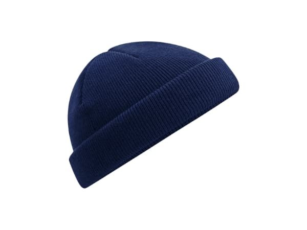 Navy blue knit fisherman beanie with a cuffed ribbed texture on a white background