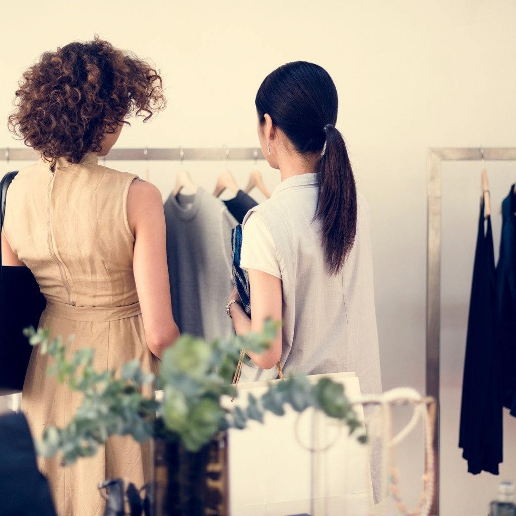 Quality assurance professionals at Fashion Soul International reviewing garment quality, fabric standards, and production details to ensure premium apparel manufacturing excellence.